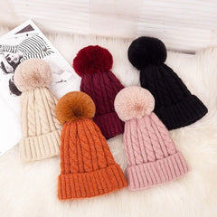 Women's Braided Beanie with Removable Pom-Pom - model wearing