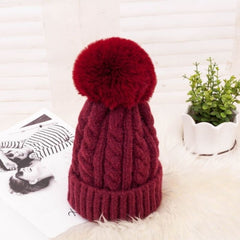 Women's Braided Beanie with Removable Pom-Pom - model wearing